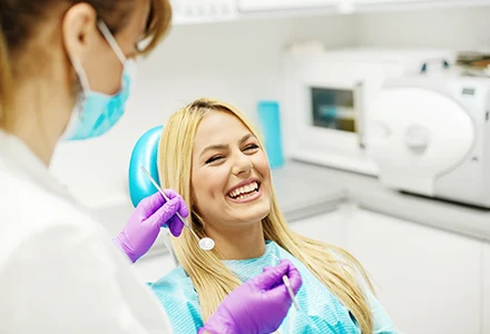 Smiling lady in Macomb Dental Group in sterling heights, MI