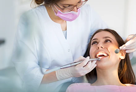 smiling lady with dentist